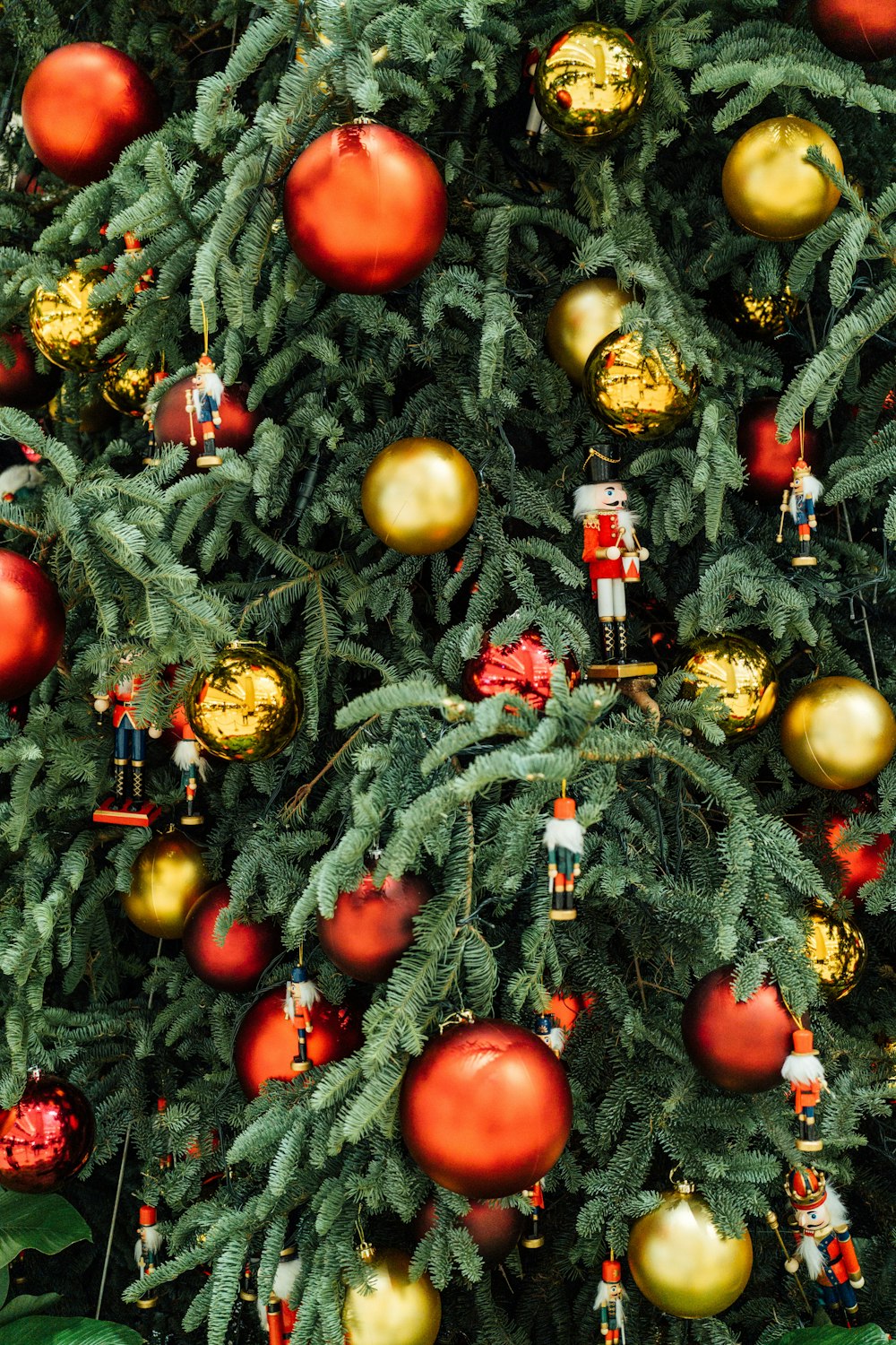 a christmas tree with ornaments hanging from it