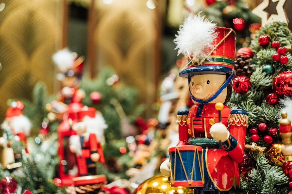 a nutcracker figurine sitting on top of a christmas tree
