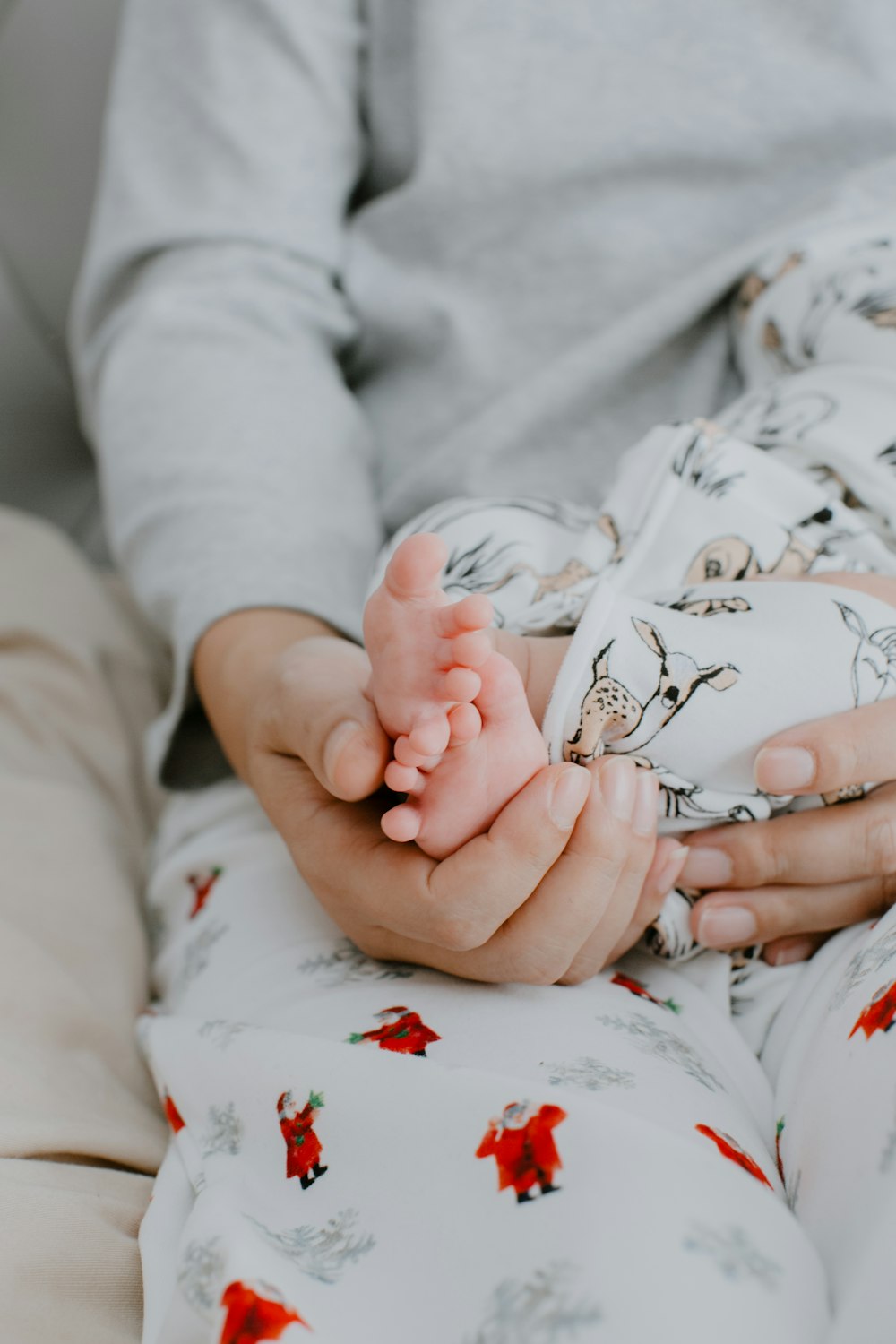 a person holding a baby in their hands