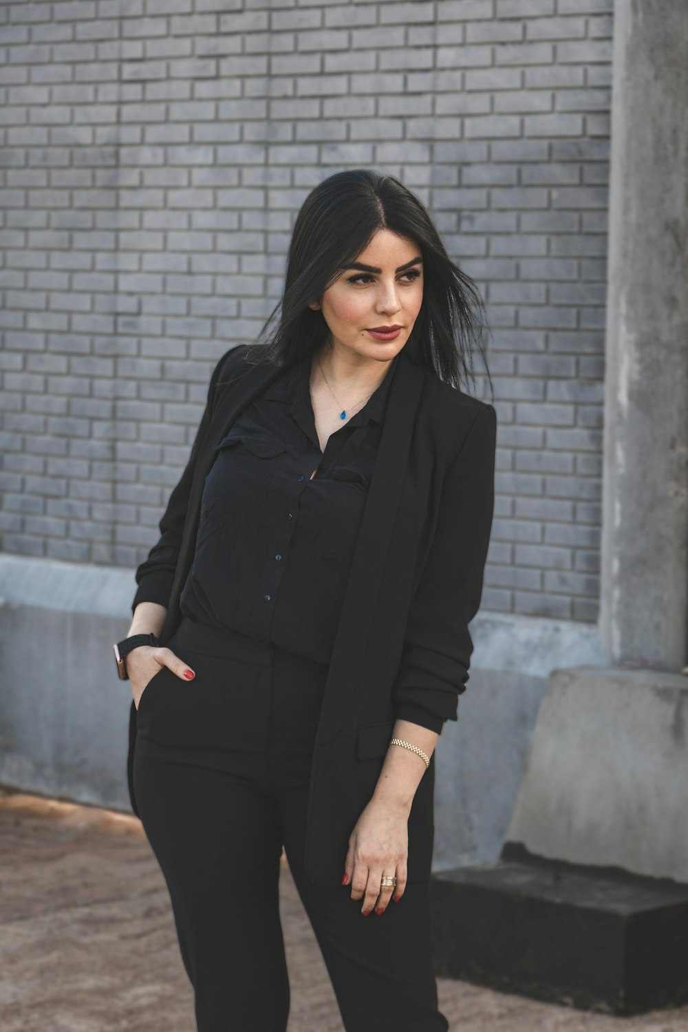 a woman in a black shirt and black pants