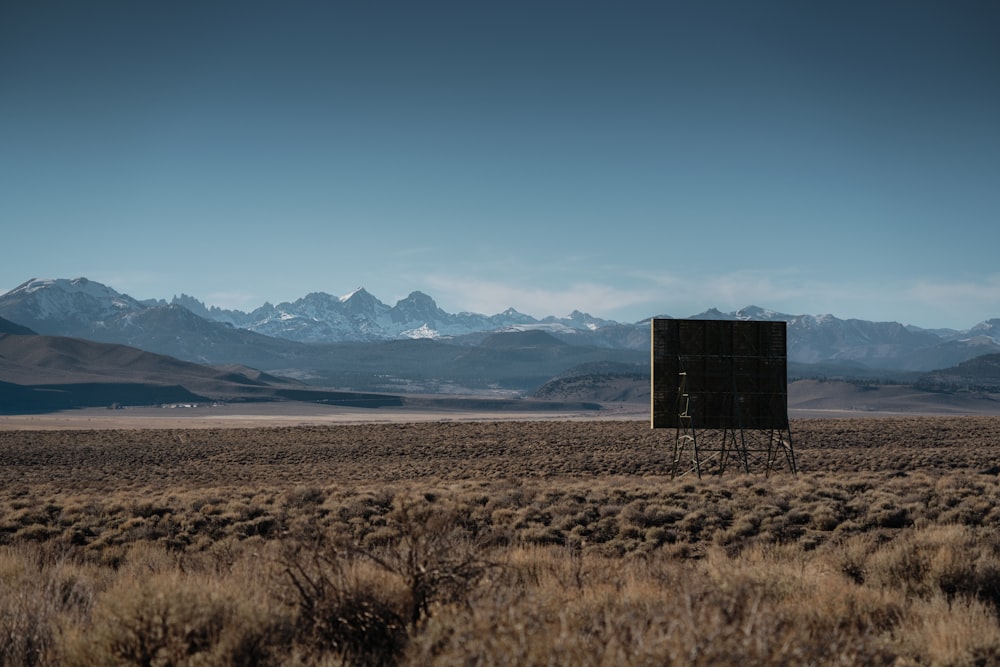 a field with a sign in the middle of it