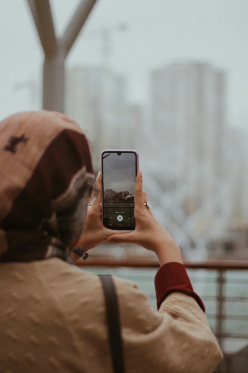 a person taking a picture with a cell phone