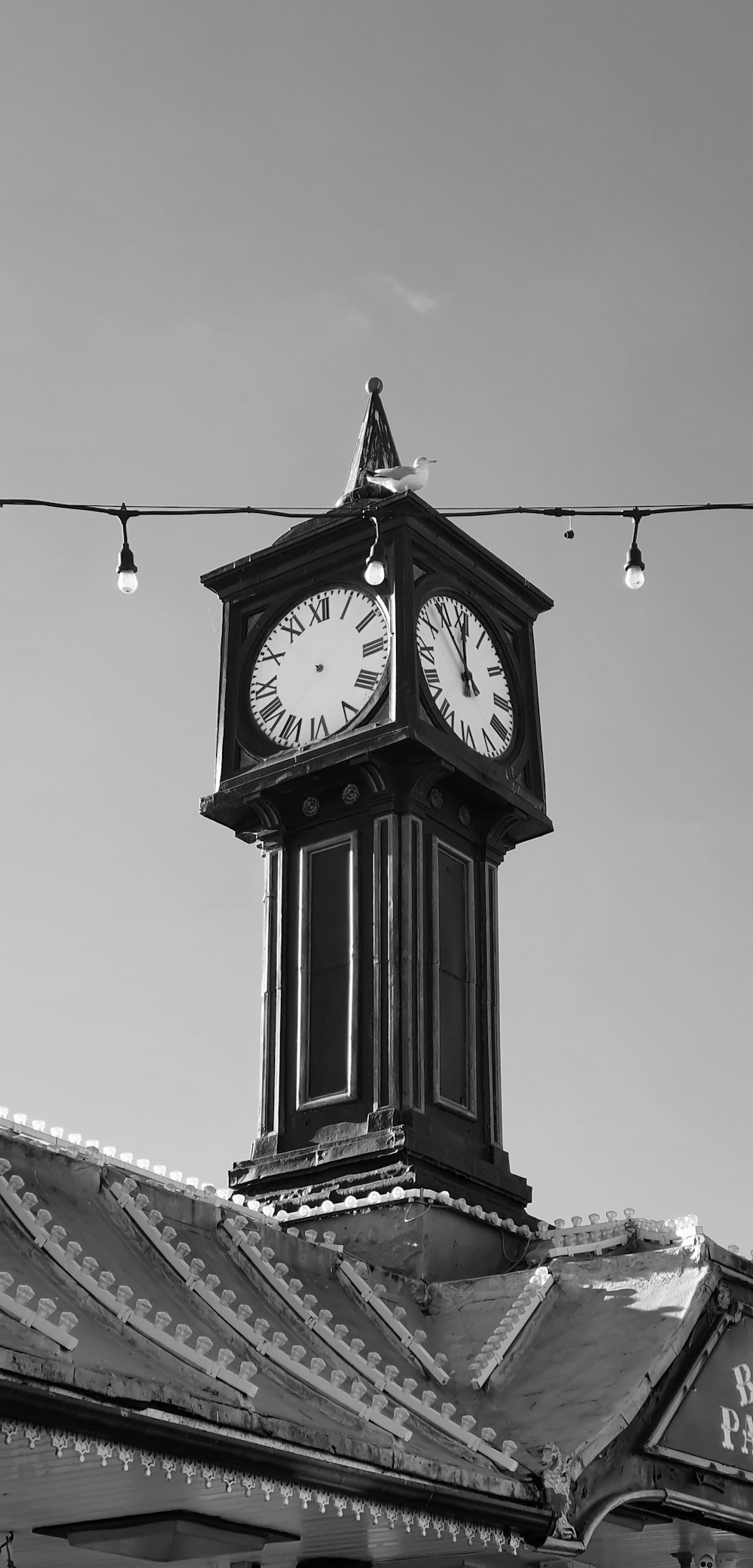 a black and white photo of a clock tower