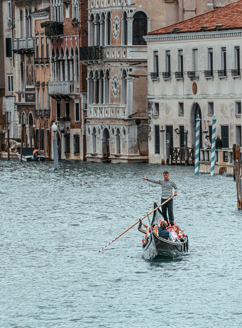 a group of people riding in a boat on a body of water