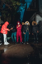 a group of people standing around each other