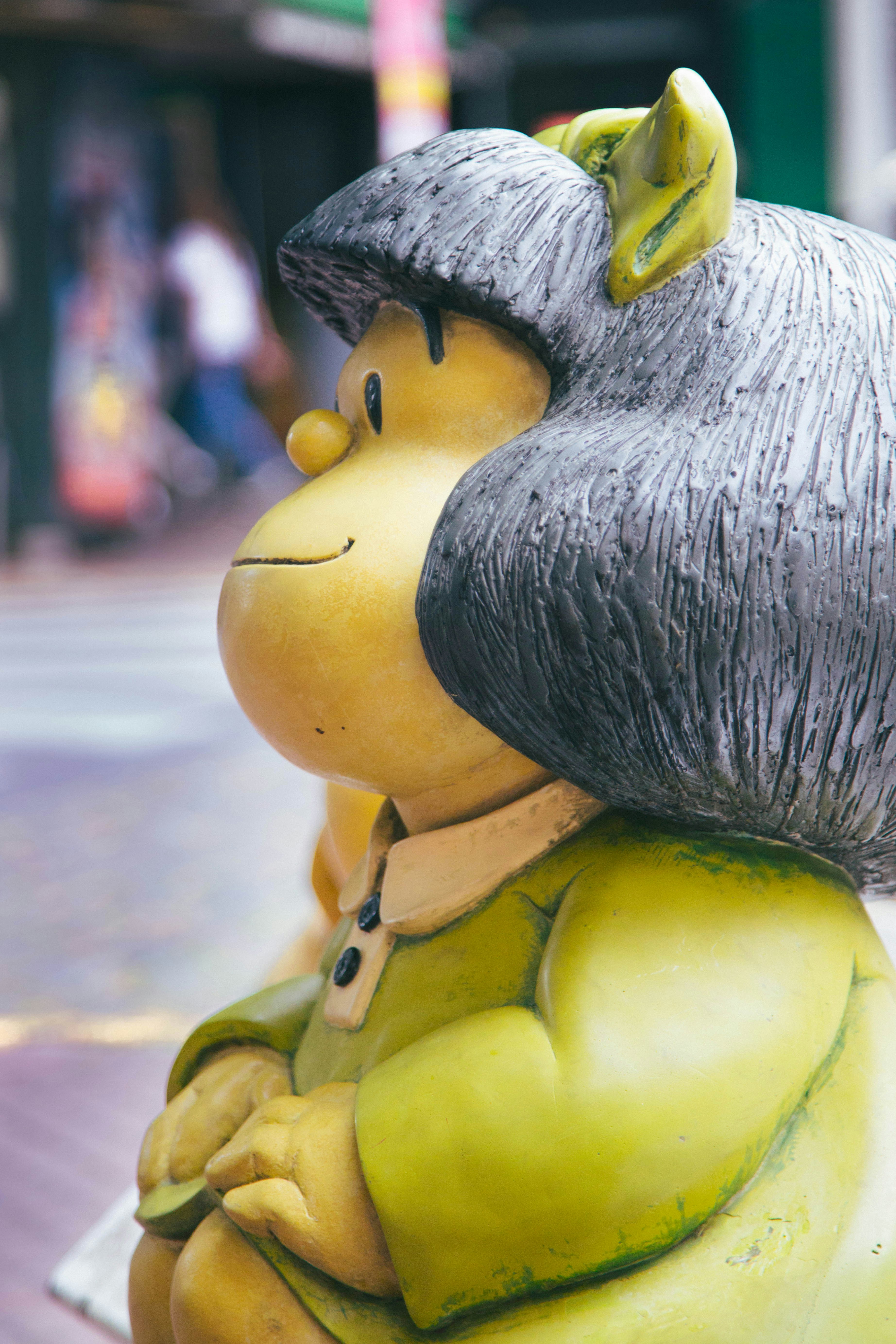 a statue of a person with a hat on