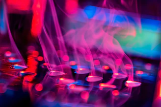 A retro-futuristic vaporwave collage featuring a marble bust with neon blue Japanese kanji glowing beneath, set against a pink-purple gradient background with floating turquoise dolphins.