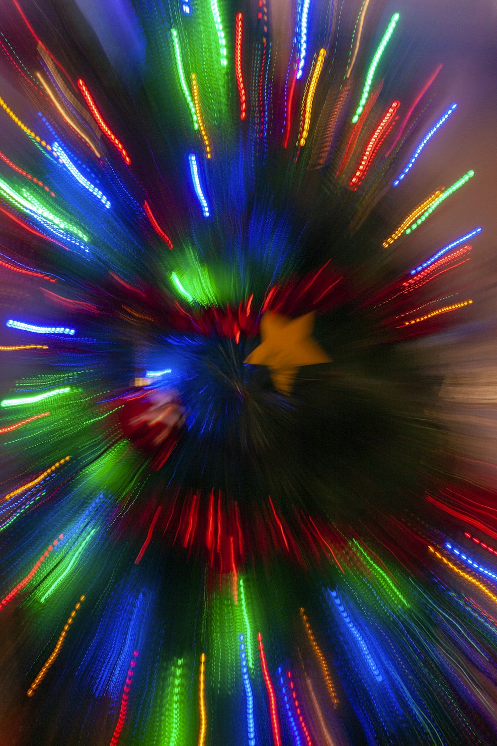 a colorful fireworks display with a star in the middle