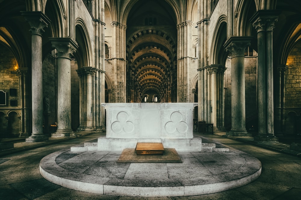 a large cathedral with a bench in the middle of it