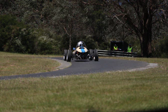 Hugo coaching a driver intensely during a track session.