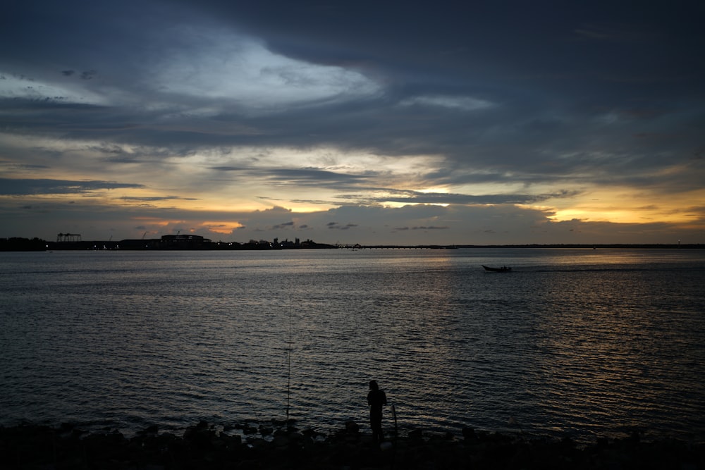 a body of water with a boat in the distance