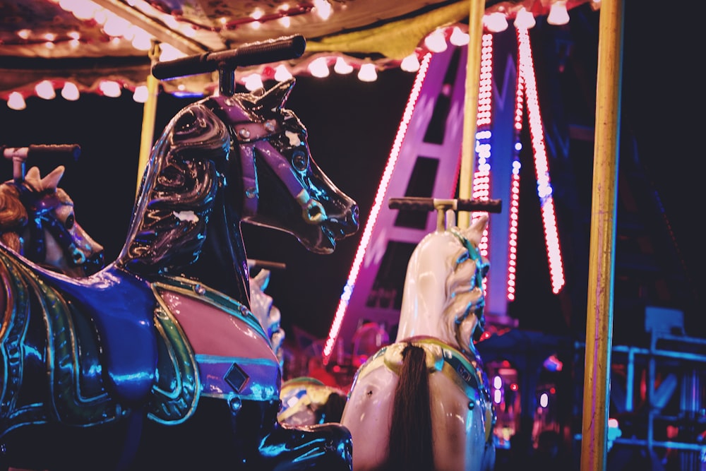 a merry go round with a horse on top of it