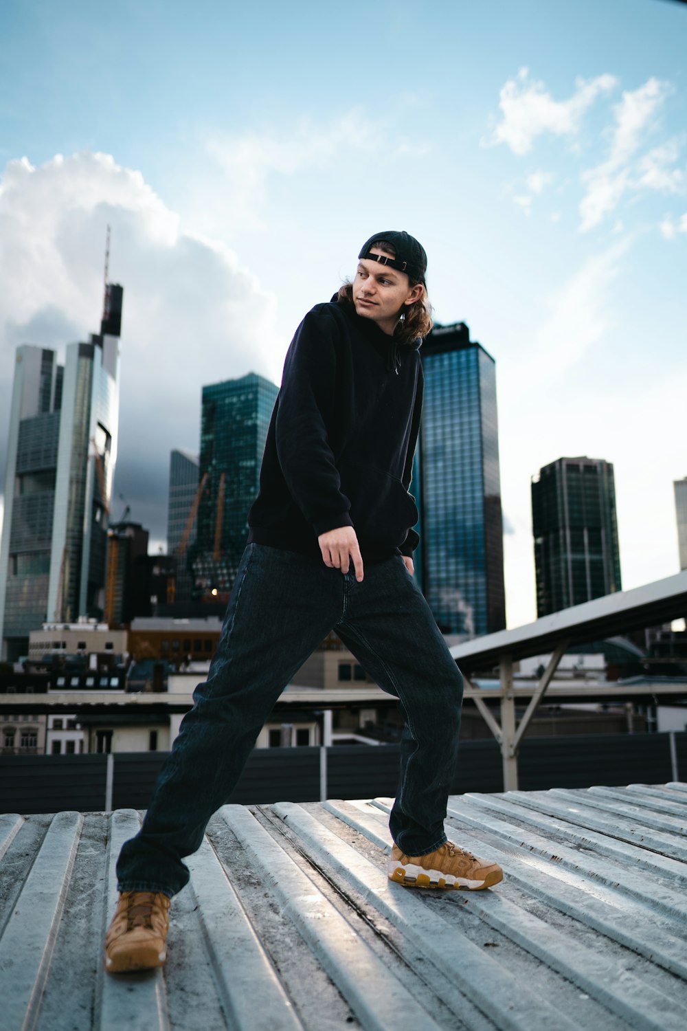 a man standing on top of a wooden platform