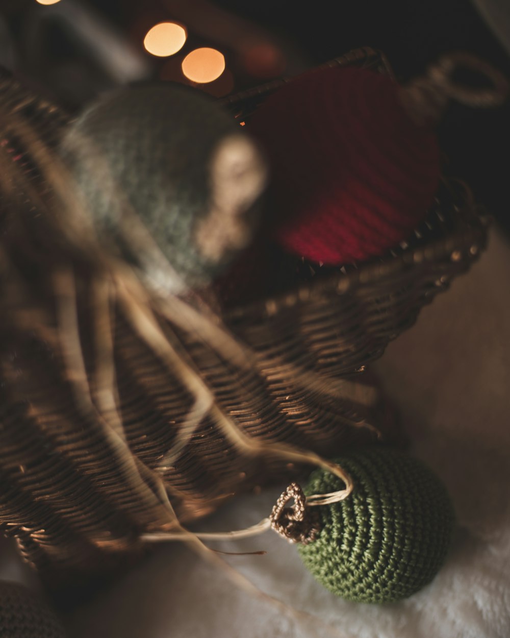 a close up of a knitted object in a basket