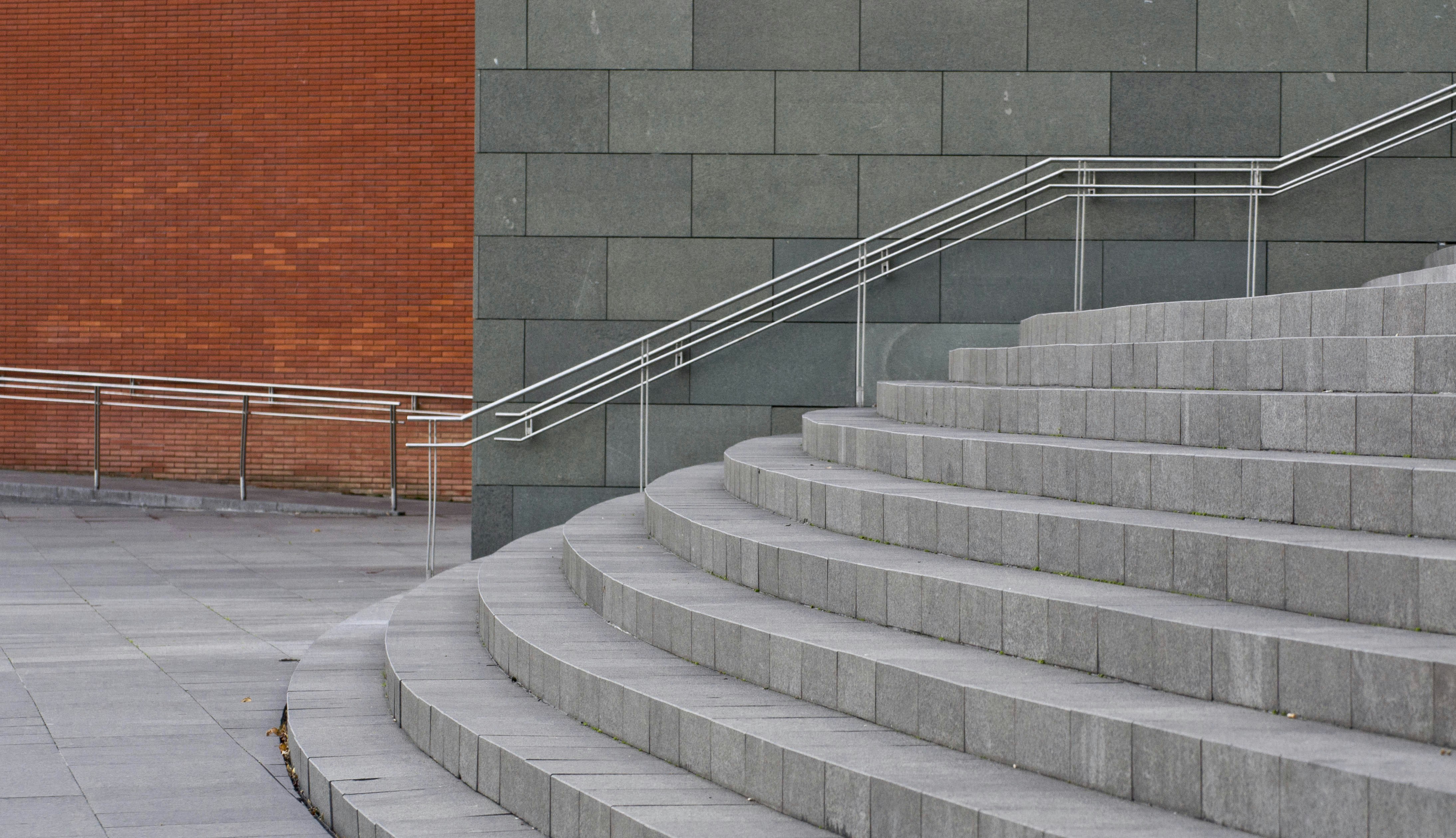 grey stairsteps with red and grey walls in background