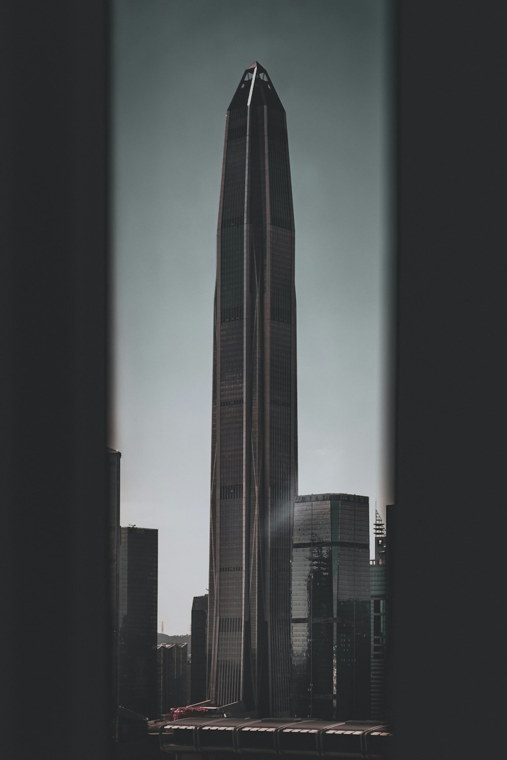 a very tall building in the middle of a city