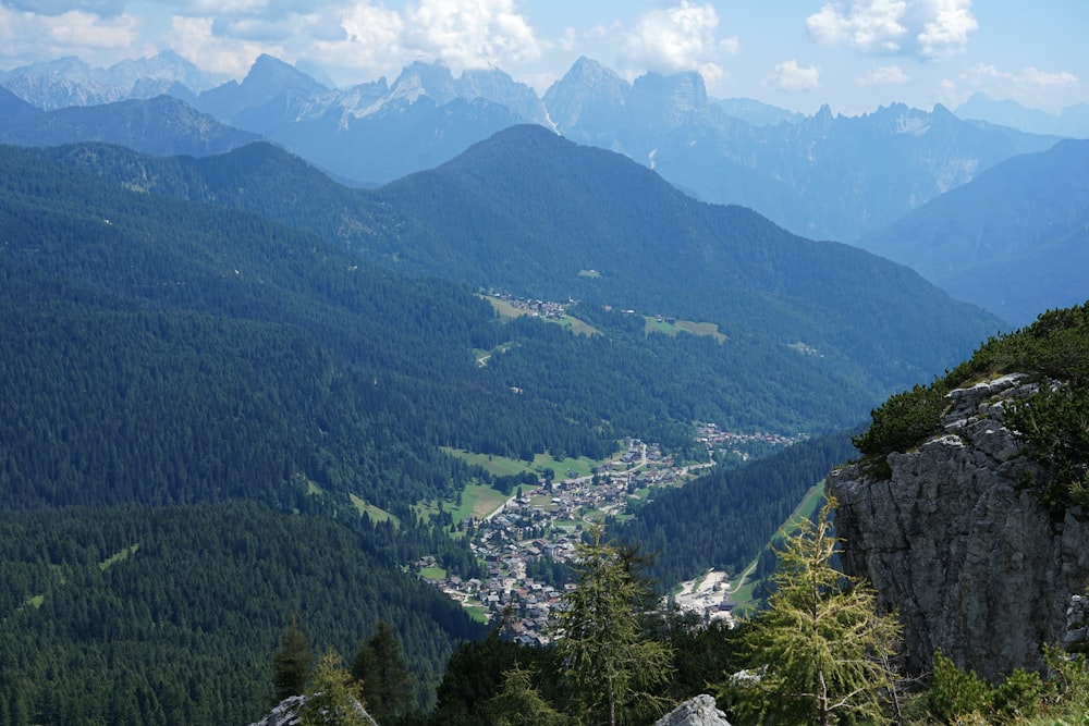 a view of a valley with mountains in the background