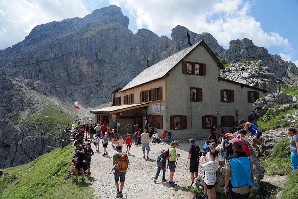 a group of people standing outside of a building