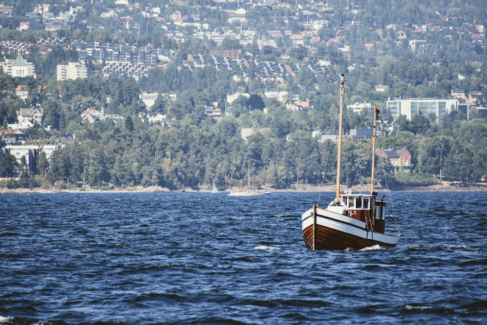 a boat floating on top of a large body of water