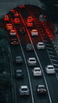 a highway filled with lots of traffic at night