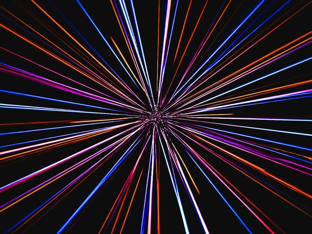 a black background with colorful lines in the center