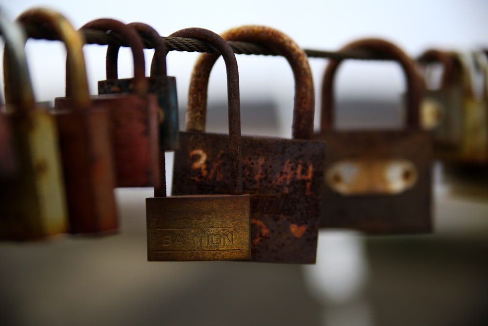 a bunch of padlocks hanging on a line