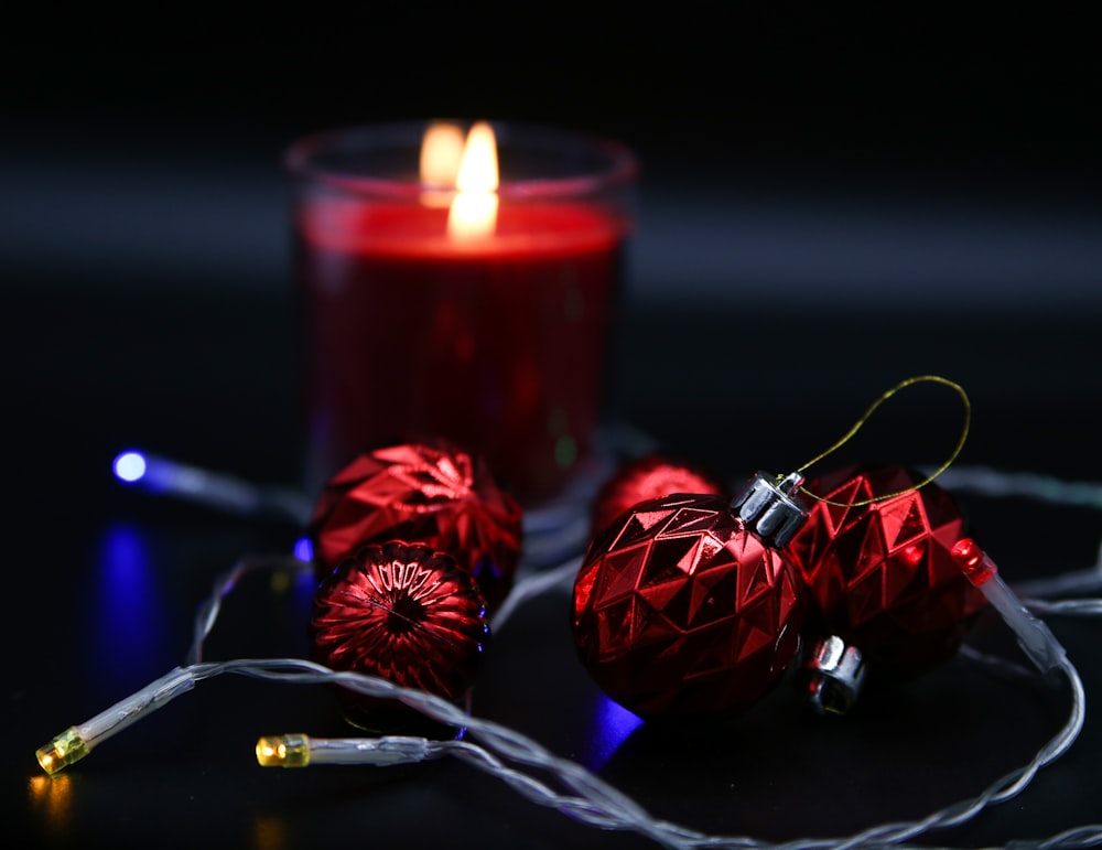 a candle and some ornaments on a table