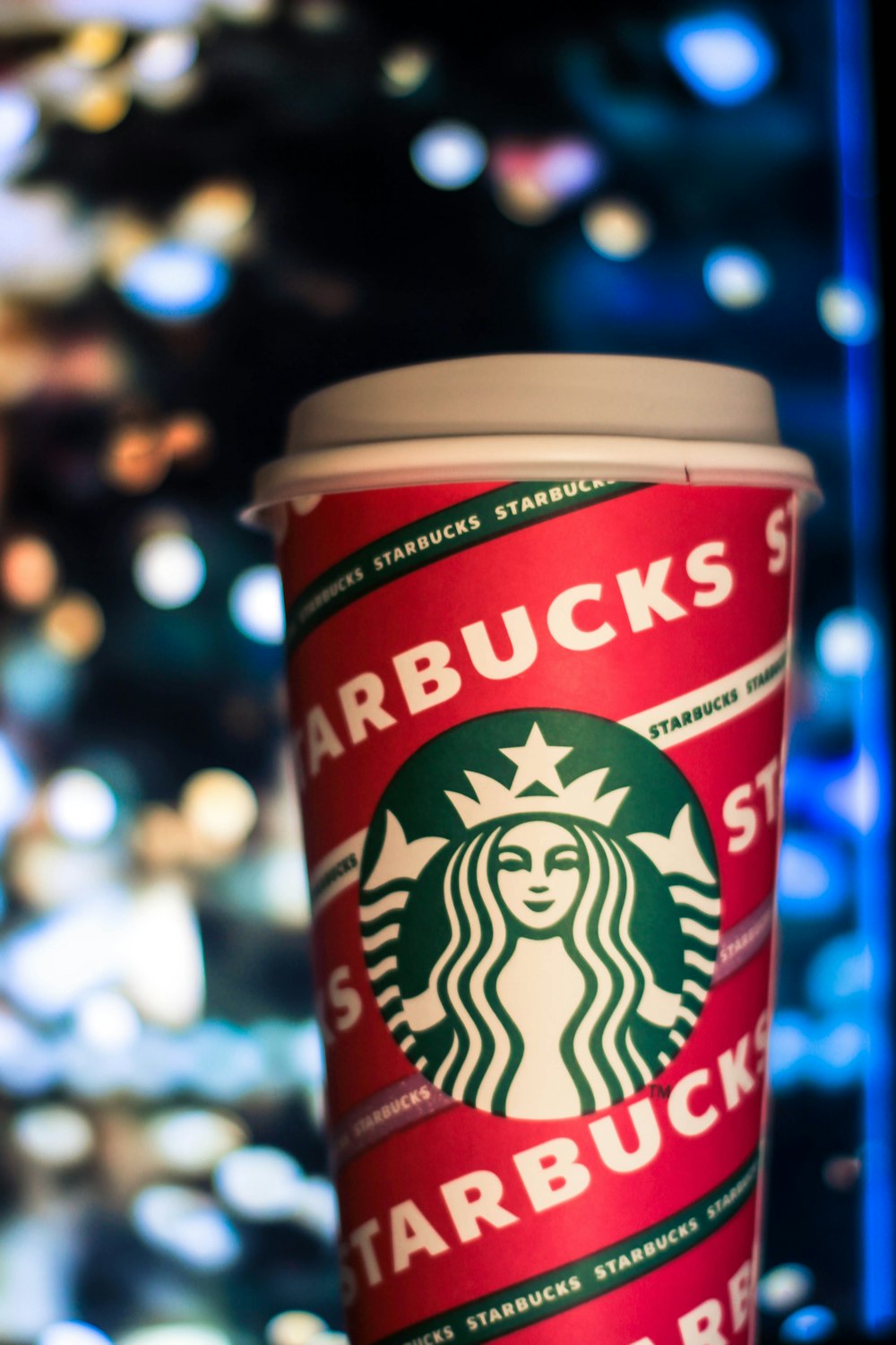 a starbucks cup sitting on top of a table