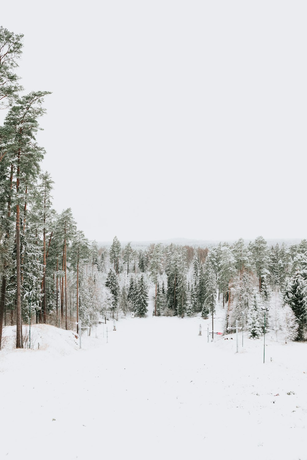 a man riding skis down a snow covered slope