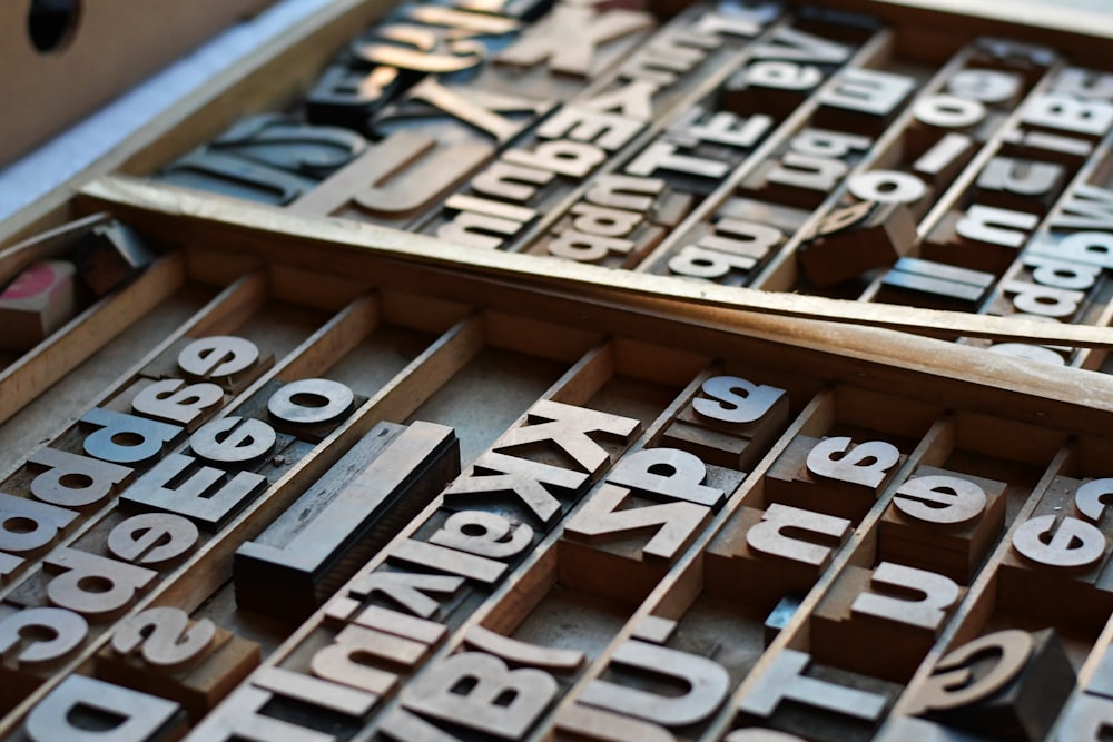 a couple of wooden type blocks sitting on top of a table