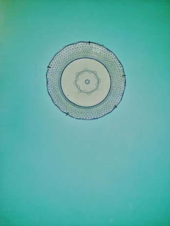 A close-up of a decorative plate installation in a modern living room.