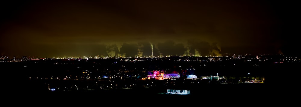 a view of a city at night from a distance