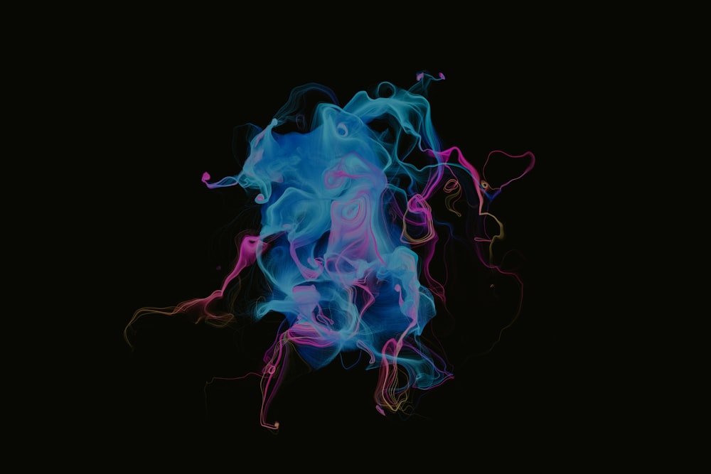 a black background with blue and pink smoke