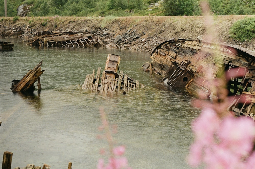 a group of wooden boats sitting on top of a river