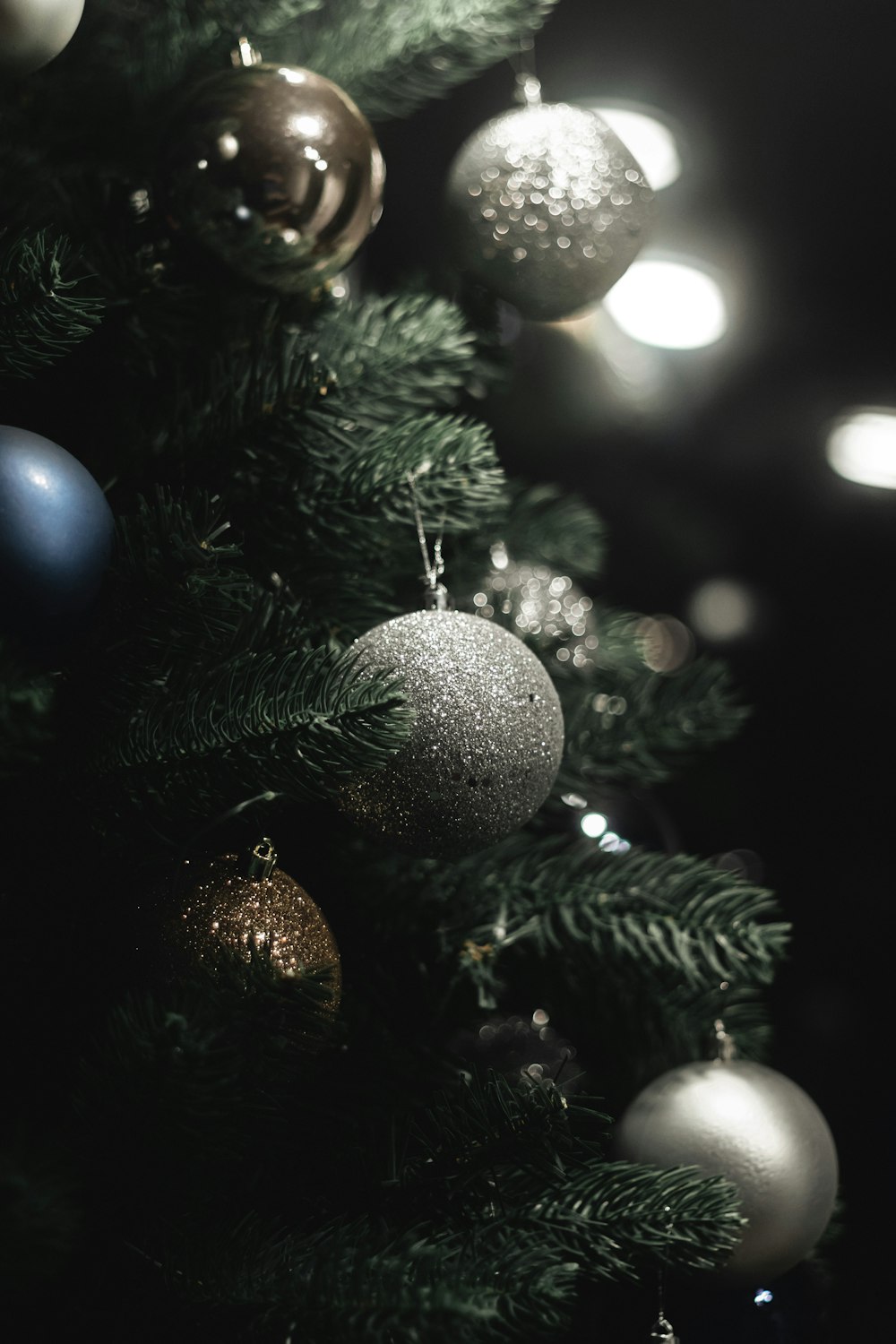 a close up of a christmas tree with ornaments