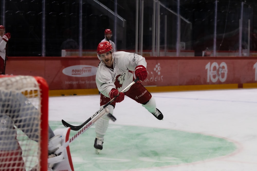 a man playing hockey on an ice rink