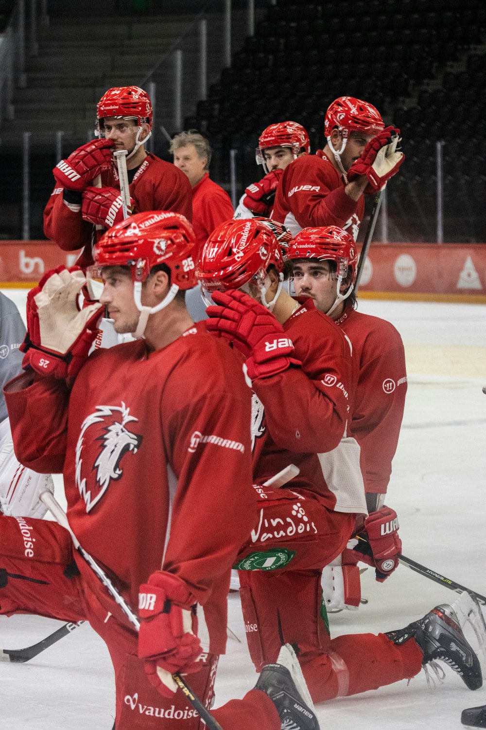 a group of young men playing a game of ice hockey