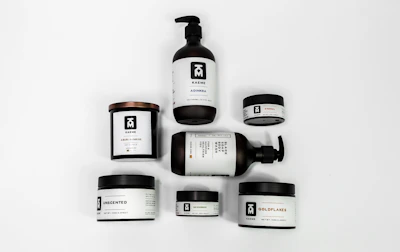 a white table topped with lots of different types of skin care products