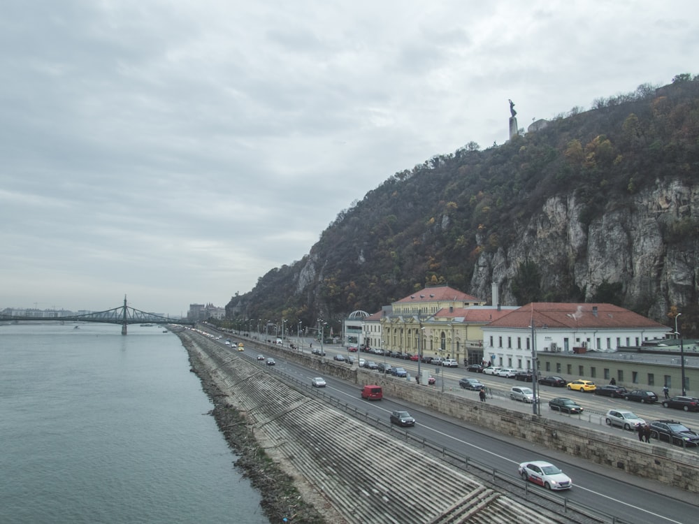 a view of a river with a bridge in the background