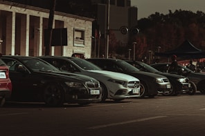 a row of parked cars in front of a building