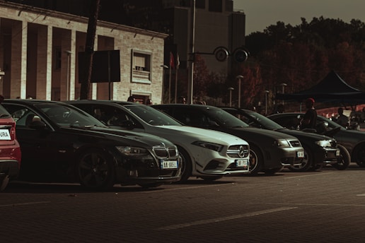 a row of parked cars in front of a building