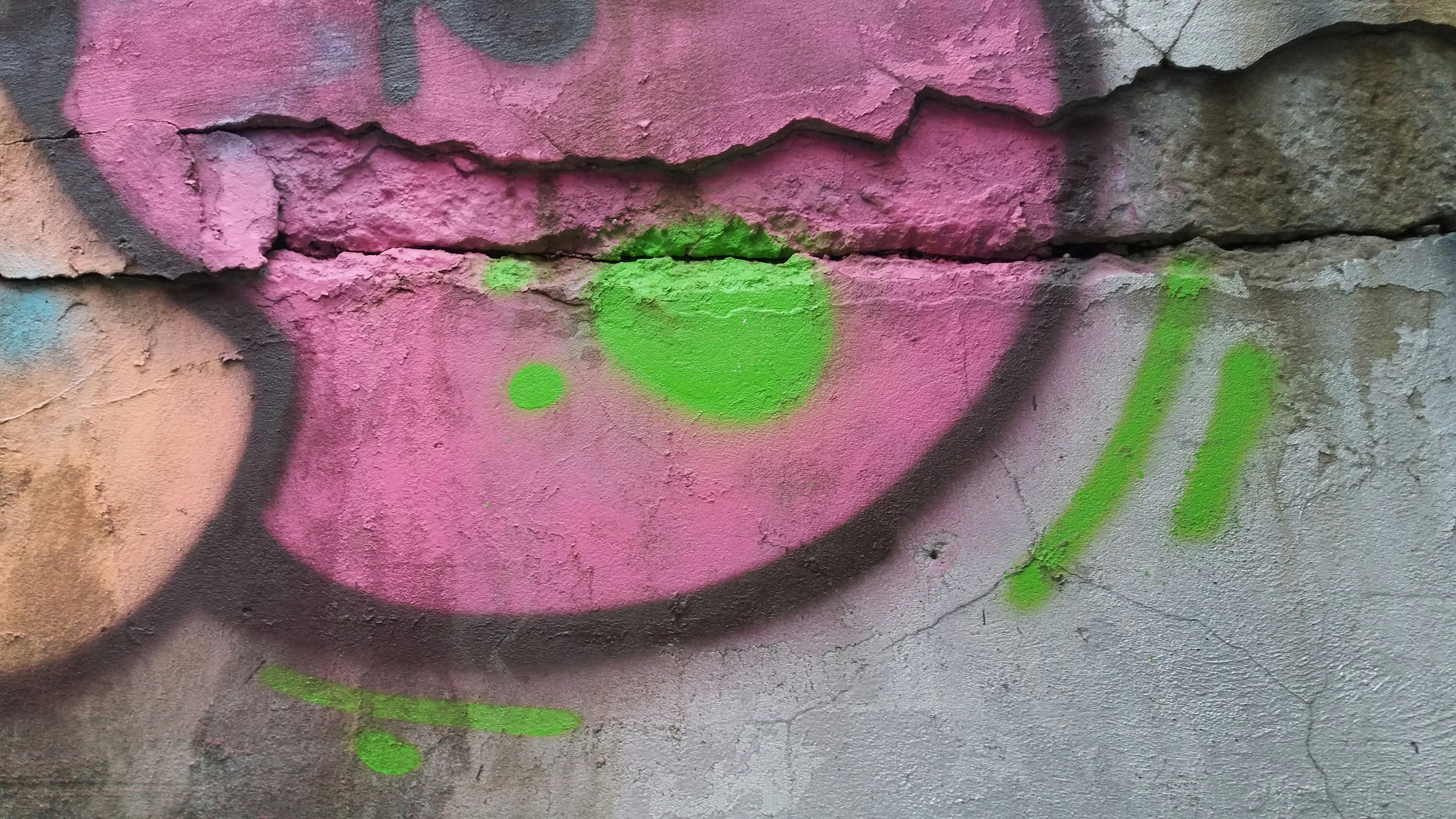 a wall that has some graffiti on it