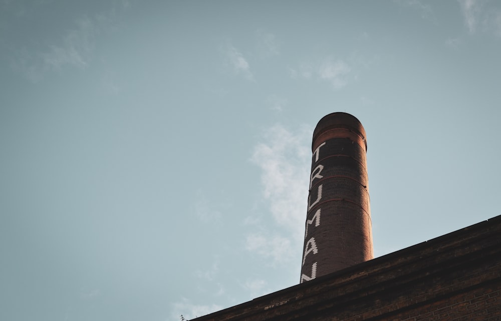 a tall brick building with a sky background