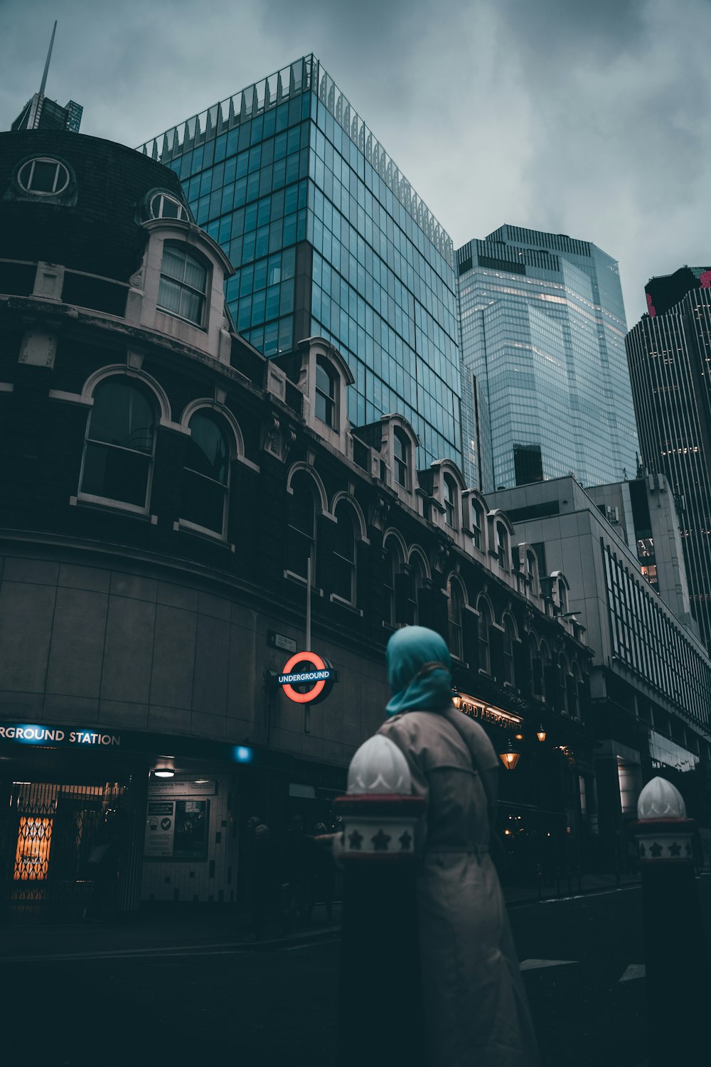 a person standing in front of a tall building