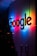 the google logo is lit up at night