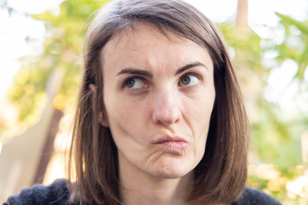 a close up of a person with a surprised look on their face