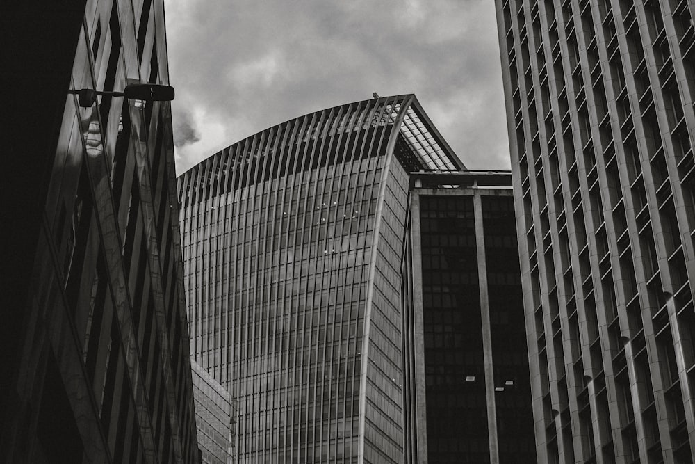 a black and white photo of some very tall buildings