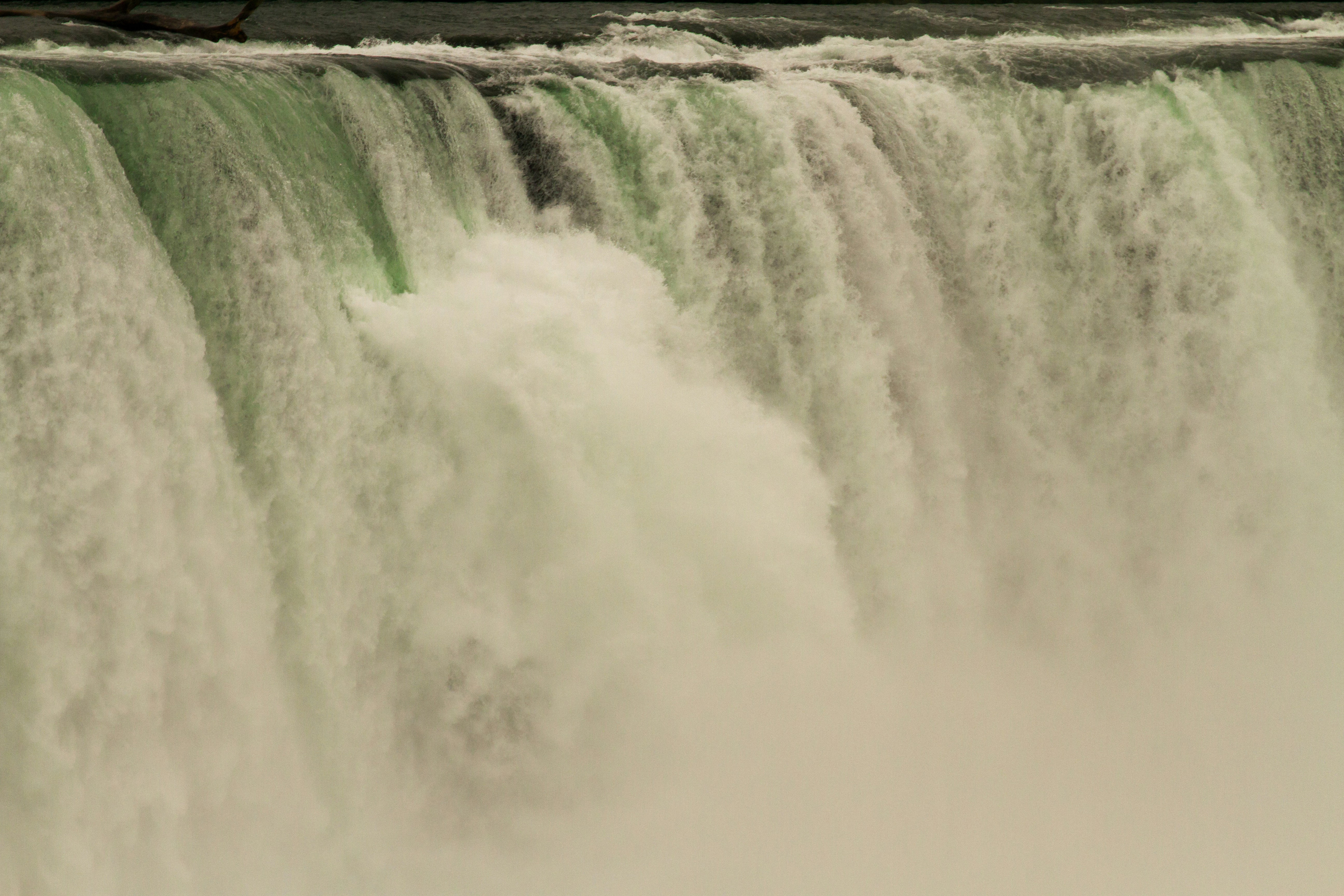 a large waterfall with water pouring out of it