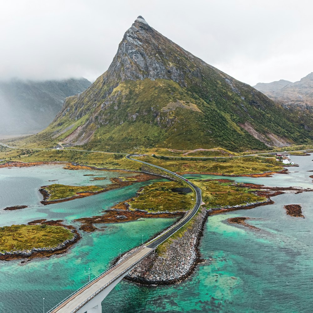 an aerial view of a bridge over a body of water