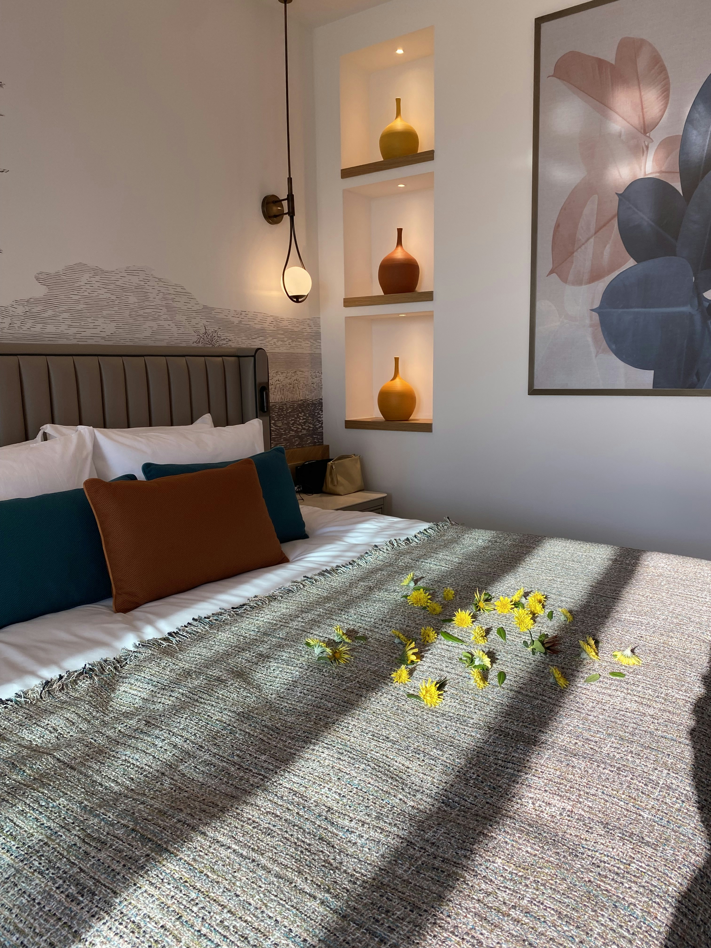 a bed with a bunch of flowers on top of it
